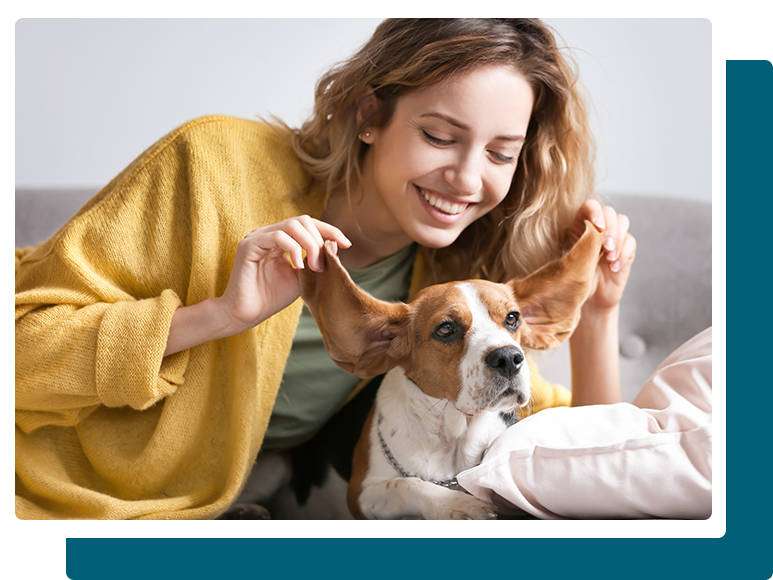 adult female playing with her dog